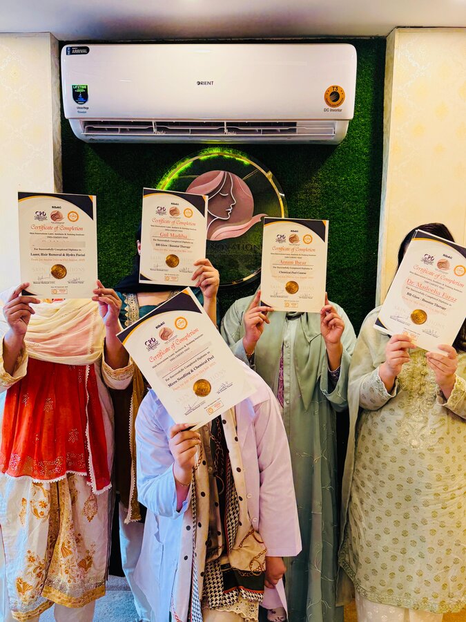 Skin Innovations training graduates holding their completion certificates