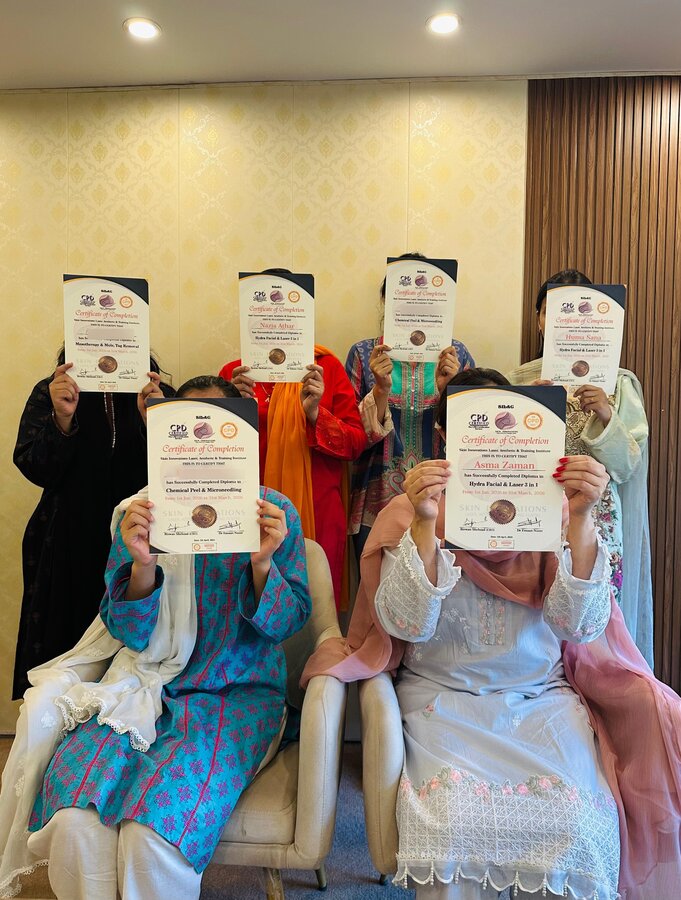 Skin Innovations training graduates holding their completion certificates